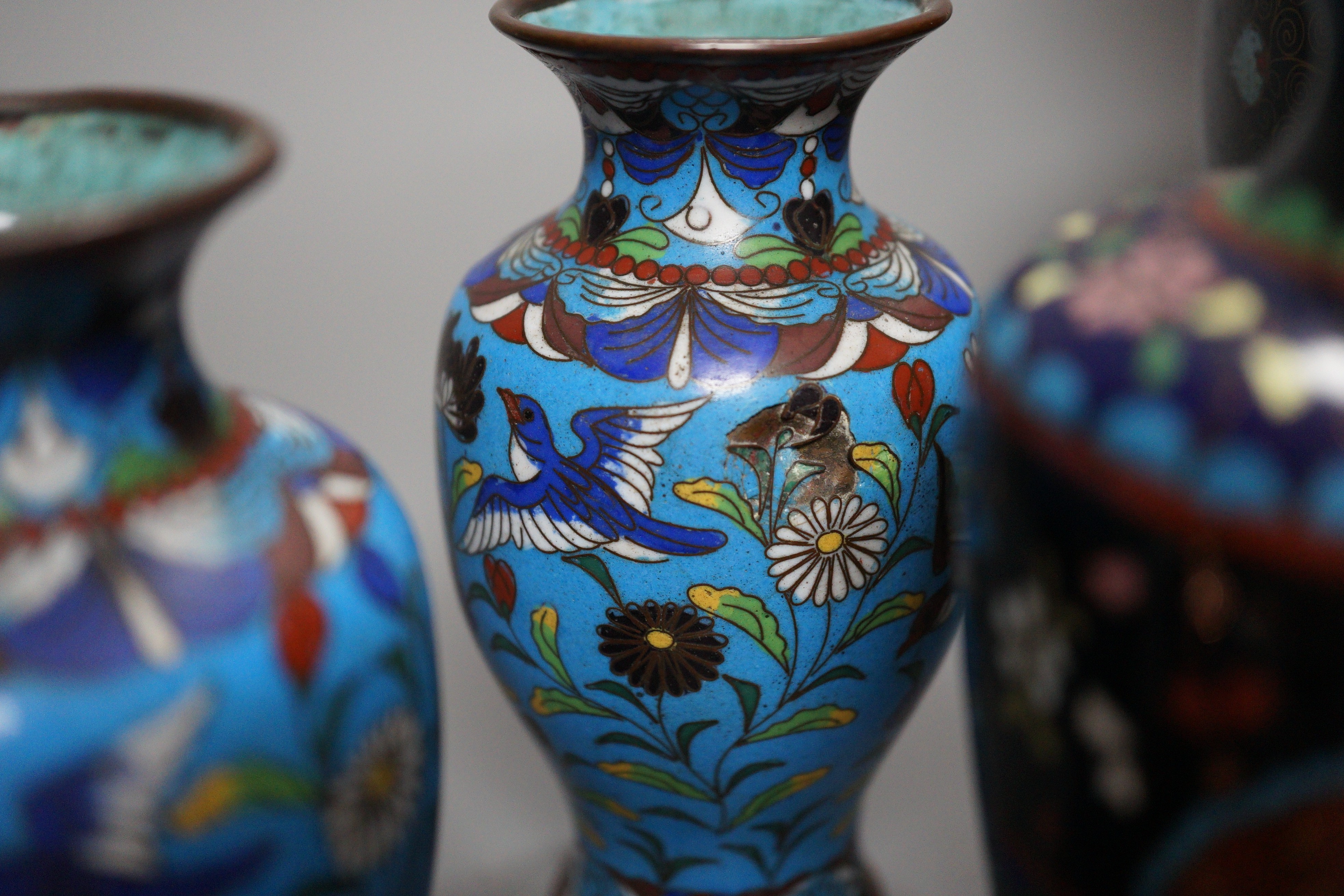 A Himalayan bronze Buddha and a group of Chinese cloisonné vases